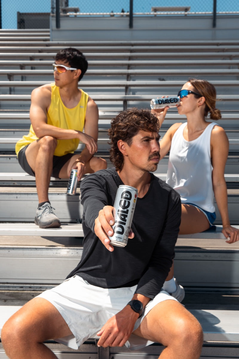 The crew with Dialed In on the bleachers